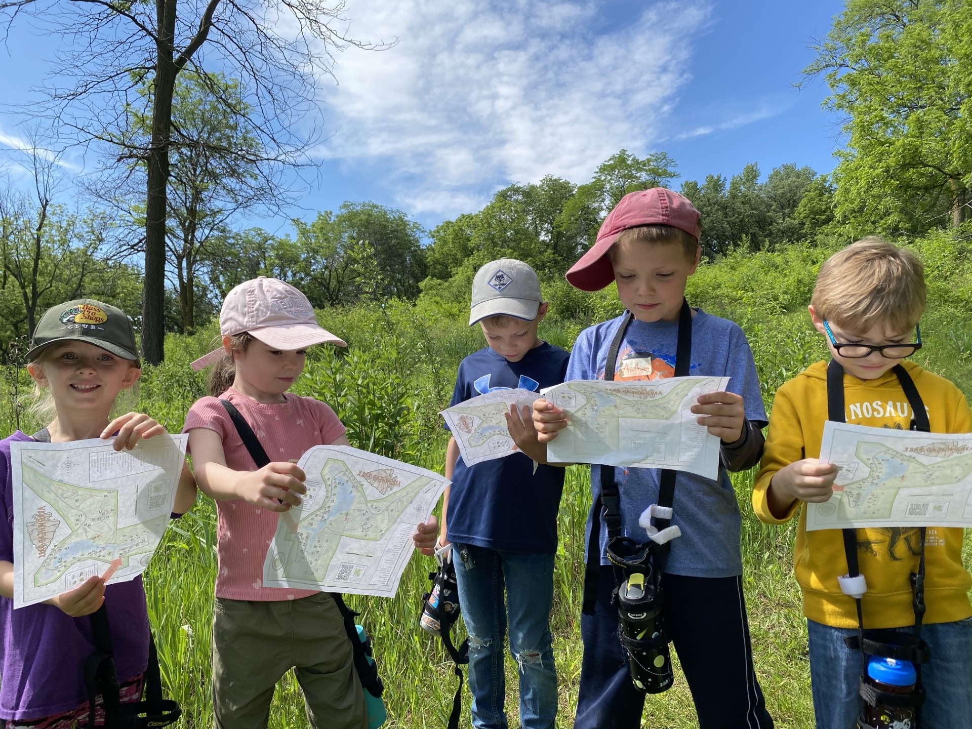 Wild Ones camp participants learn how to orient and read maps on a wilderness scavenger hunt.