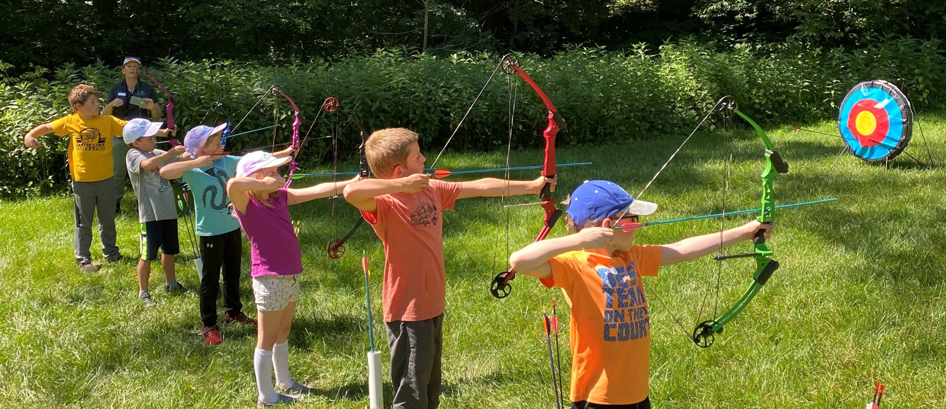 Young learners try their hand at archery.